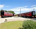 Have a fun family holiday at Brunel Boutique Railway Carriage 1; Dawlish Warren