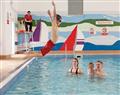 Enjoy a dip in the pool at Canlestson Lodge; Carmarthen
