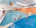 Enjoy a dip in the pool at Farringford Chalet; Ryde