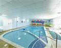 Relax in the swimming pool at Gold Plus 2 (Pet Friendly); New Romney