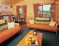 Relax in the swimming pool at Holly Tree Lodge; Bron-y-Garth, Oswestry