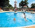 Enjoy a dip in the pool at Rhododendron Lodge 2; Ringwood