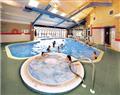 Relax in the swimming pool at Riverside Superior 3; Wooler